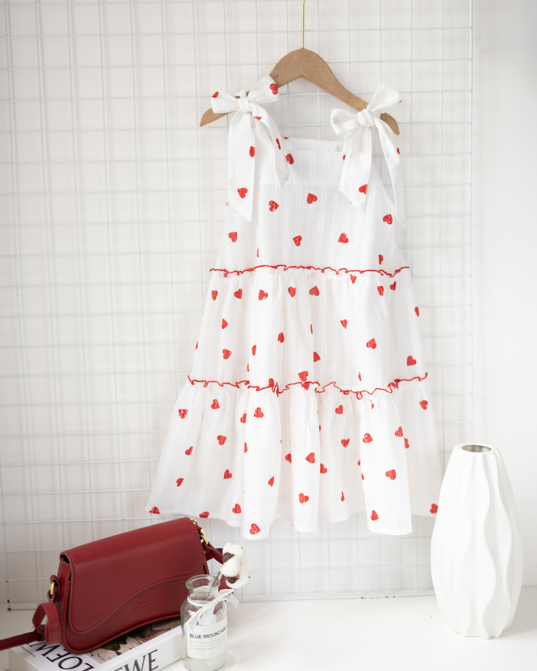 White girls cotton sundress with red heart print hanging on wooden hanger – Alwair Kids