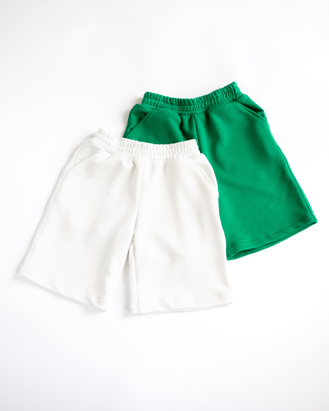 Alwair Kids boys classic cotton shorts in white and green flat lay