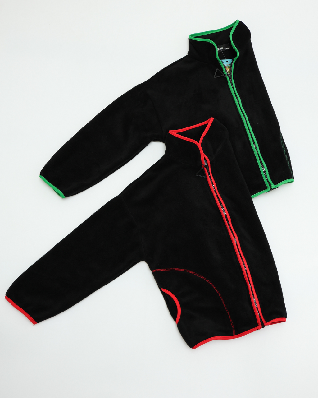Fleece jackets for kids in red and green trims shown together by Alwair Kids