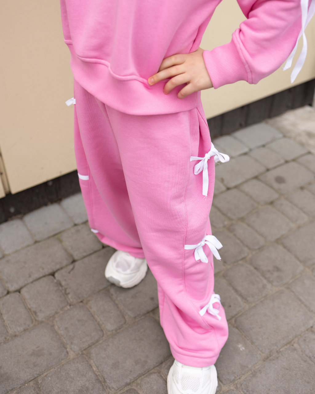 Pink palazzo pants for girls with cute white bows by Alwair Kids outdoor view

