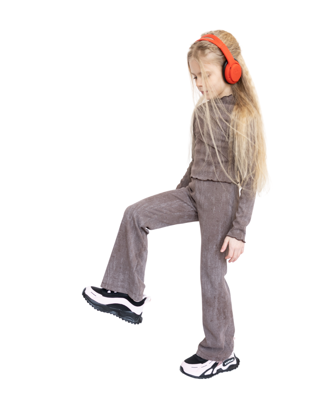 Girl wearing ribbed cotton flared leggings by Alwair Kids in motion