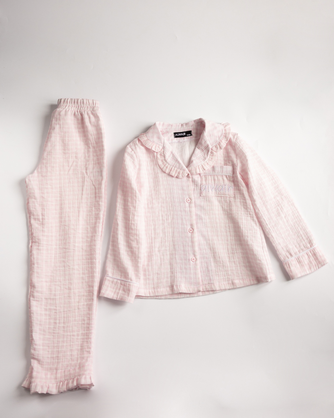 Girls’ muslin pajama set in pink check – top and pants by Alwair Kids