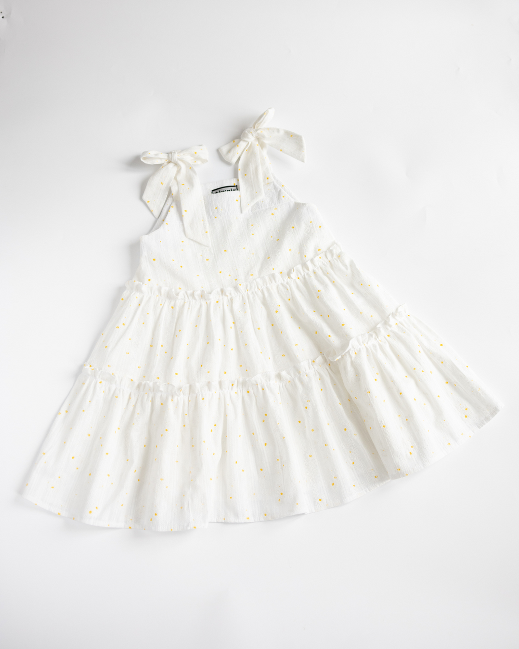 Girls white summer sundress with daisy print by Alwair Kids flat lay