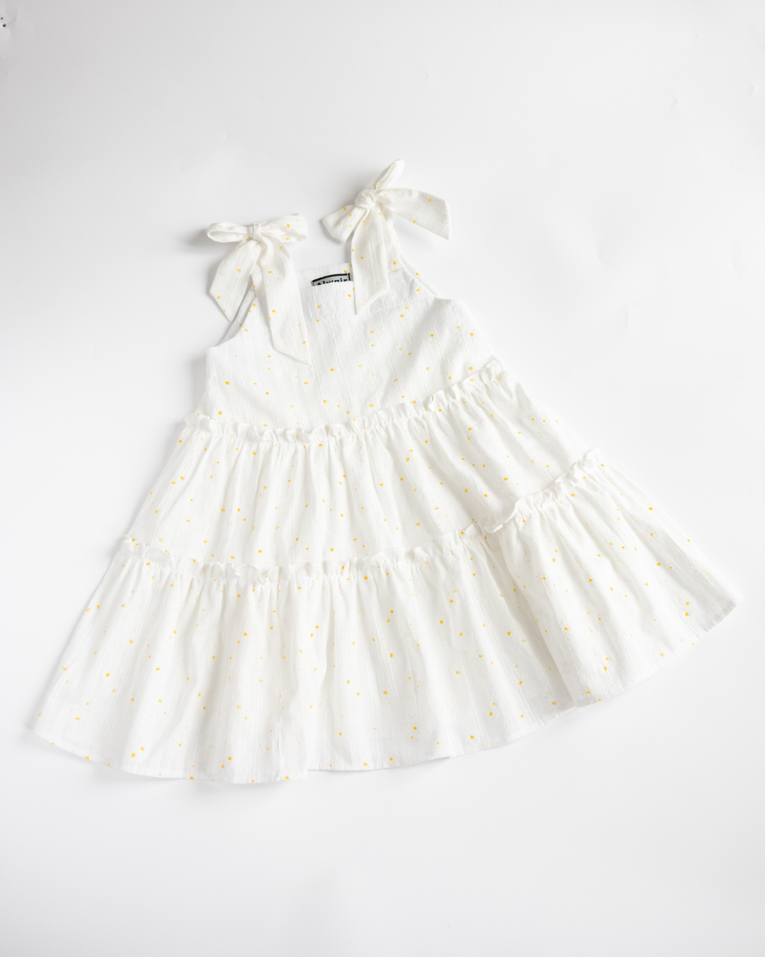 Girls white summer sundress with daisy print by Alwair Kids flat lay