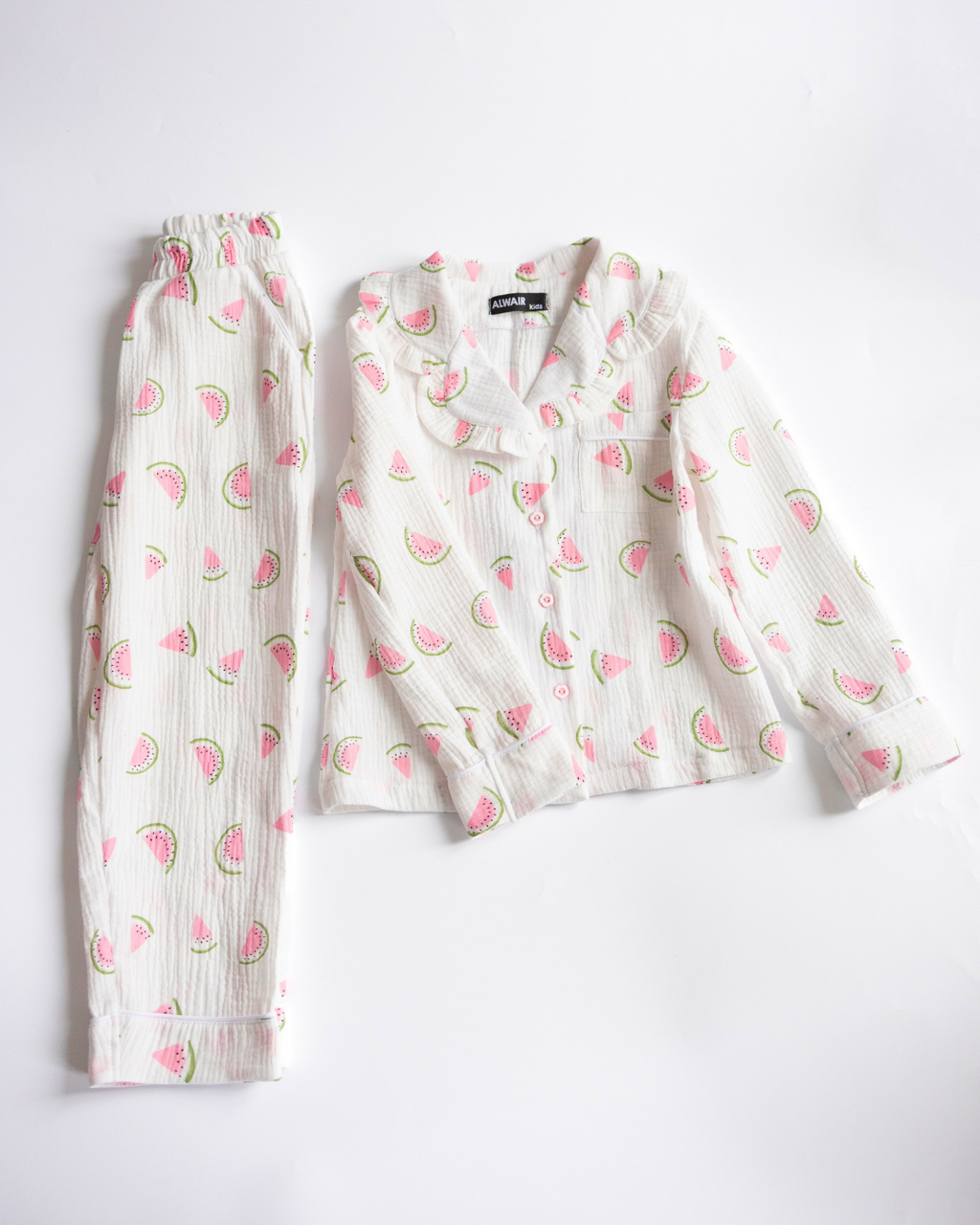 Girls' muslin pajama set with watermelon print – two-piece top and pants flat lay