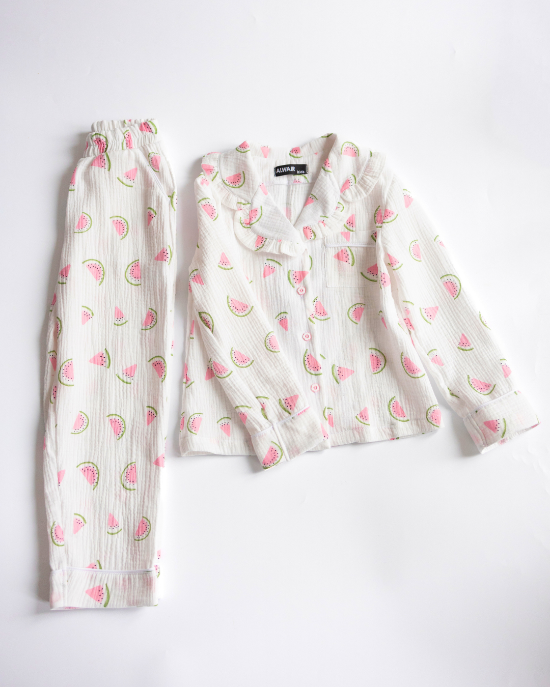 Girls' muslin pajama set with watermelon print – two-piece top and pants flat lay
