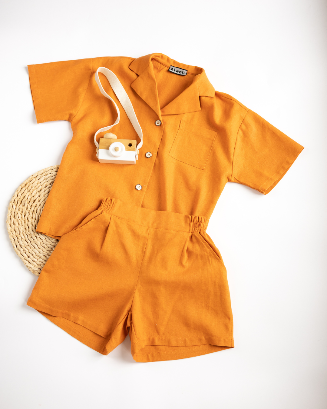 Linen summer set for kids by Alwair Kids in carrot orange with toy camera
