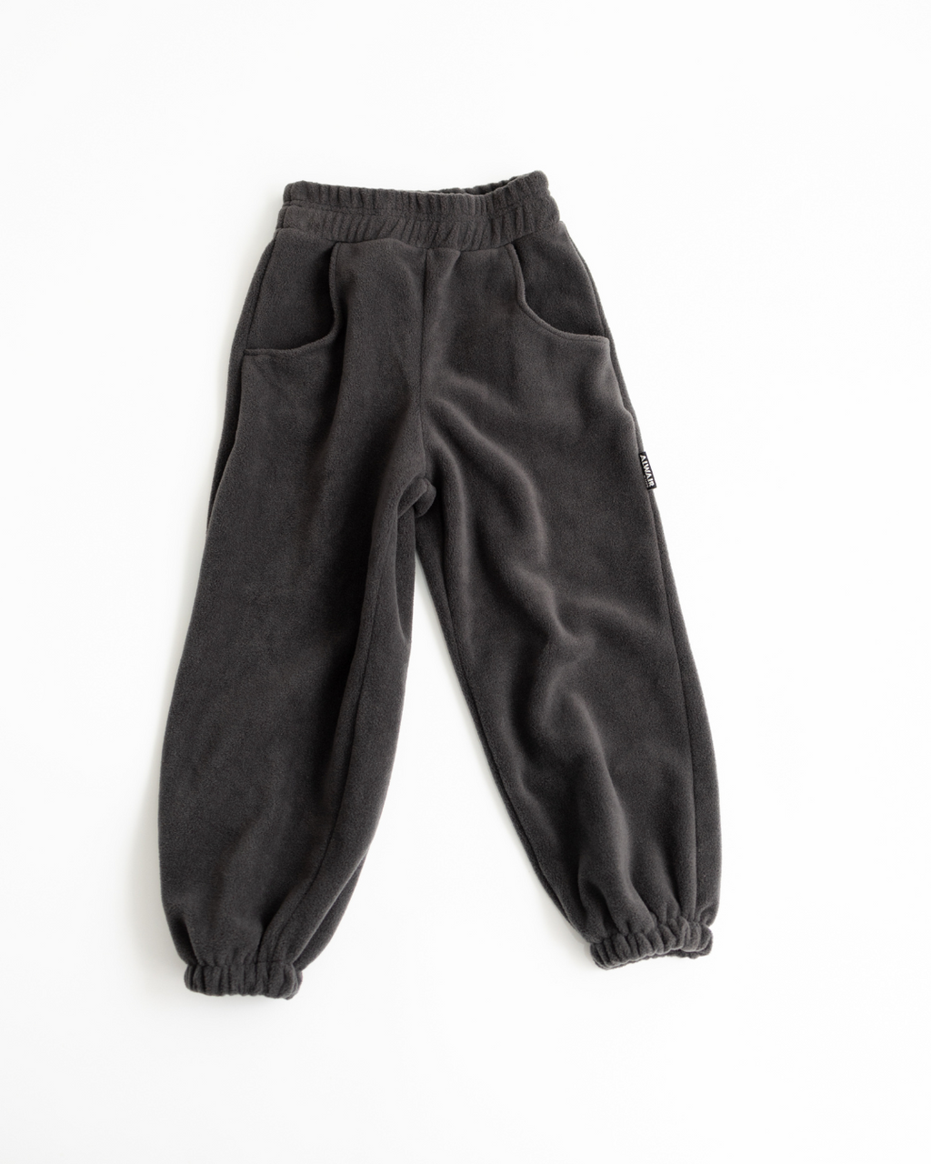 Charcoal fleece jogger pants for kids by Alwair Kids flat lay