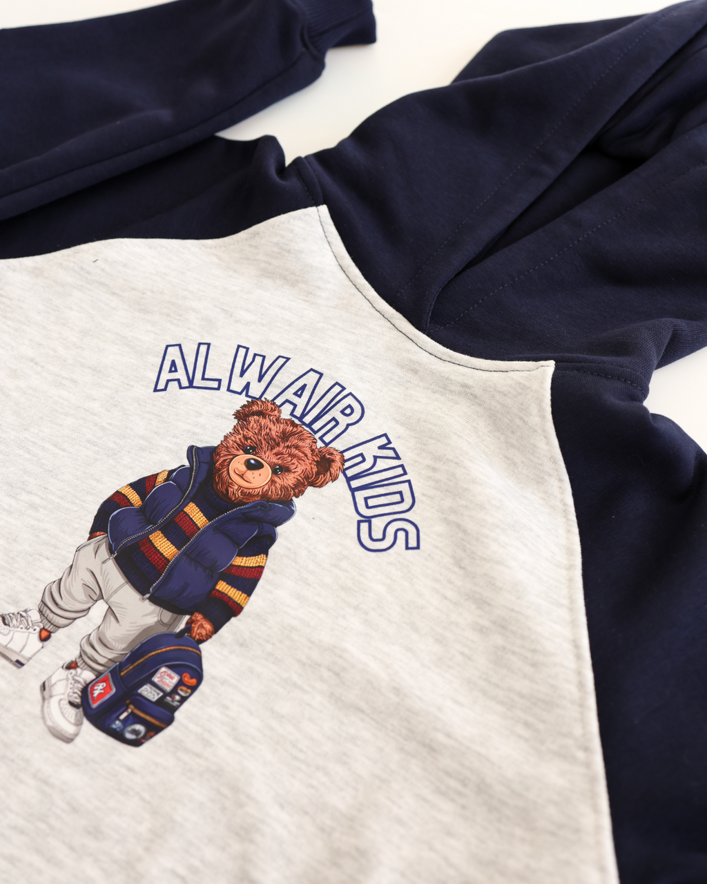 Close-up of teddy bear print on navy and grey hoodie for boys by Alwair Kids