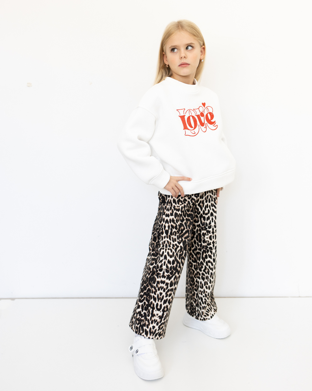 Front view of Alwair Kids white sweatshirt with red Love print