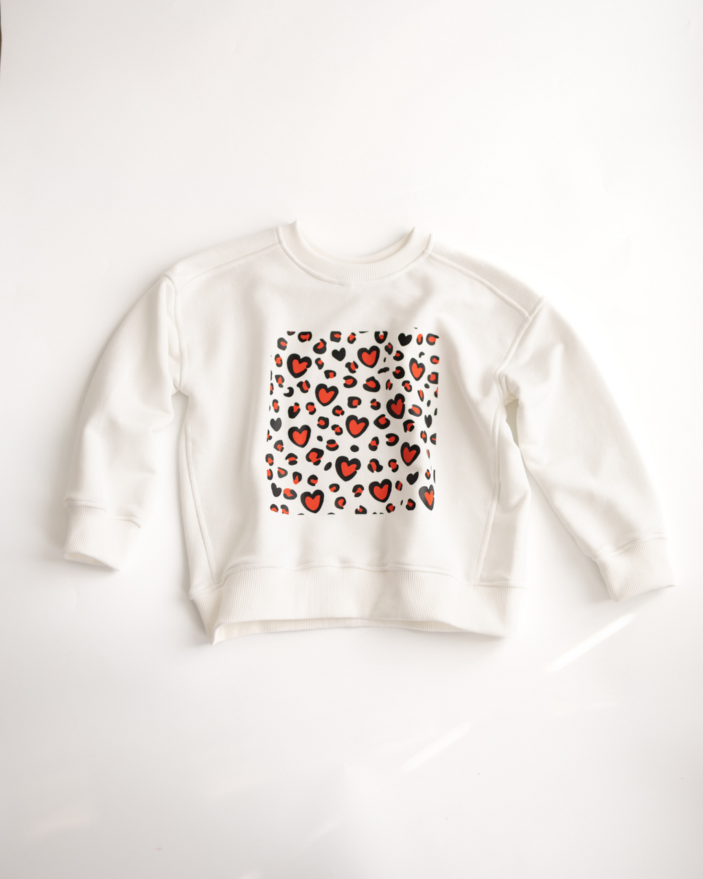 White kids sweatshirt with red heart and leopard print, front view