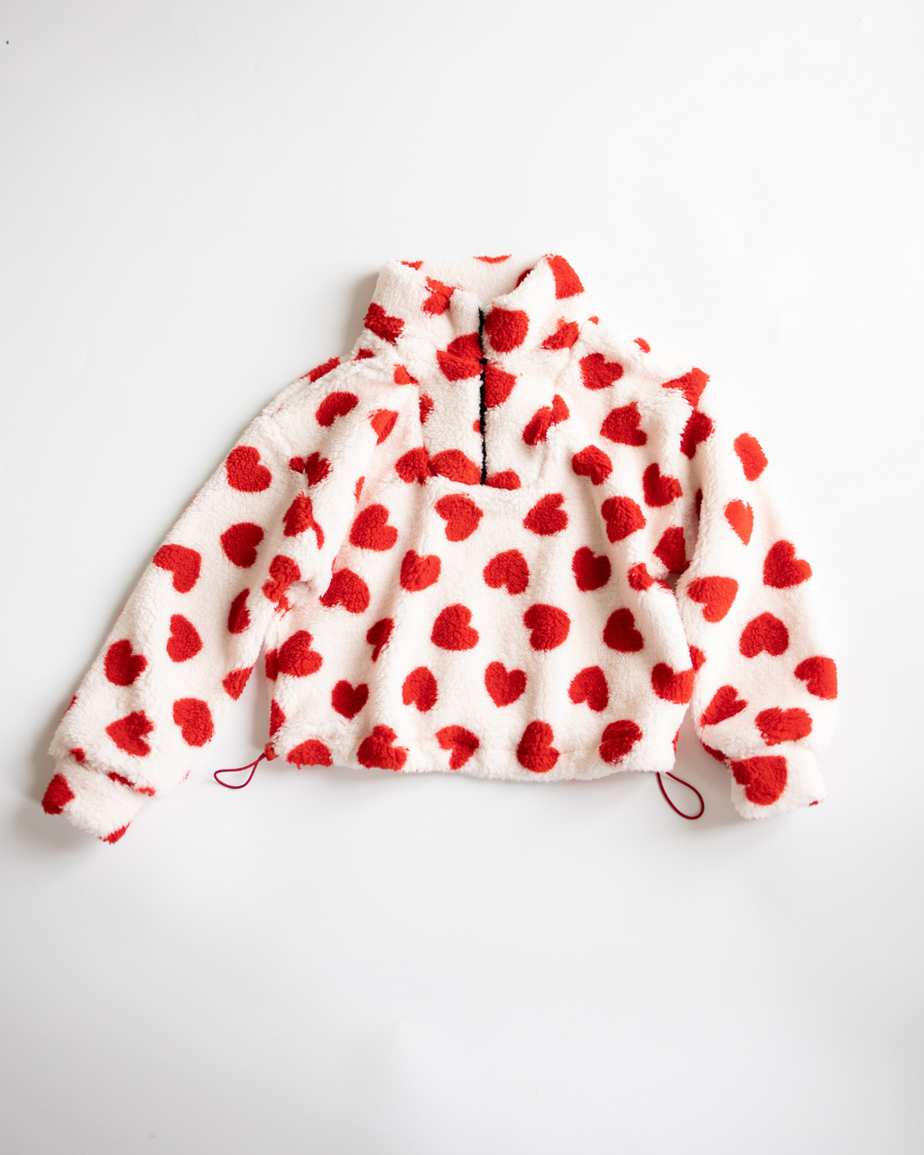 Red heart print fleece pullover for girls by Alwair Kids – front view