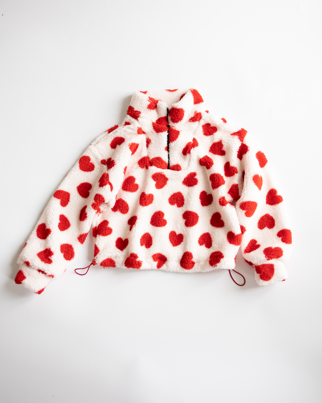 Red heart print fleece pullover for girls by Alwair Kids – front view