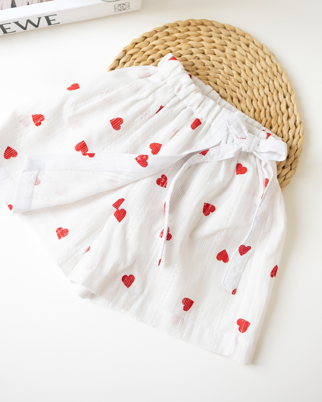 Back view of girls' white batiste skort with elastic waist and heart pattern – Alwair Kids


