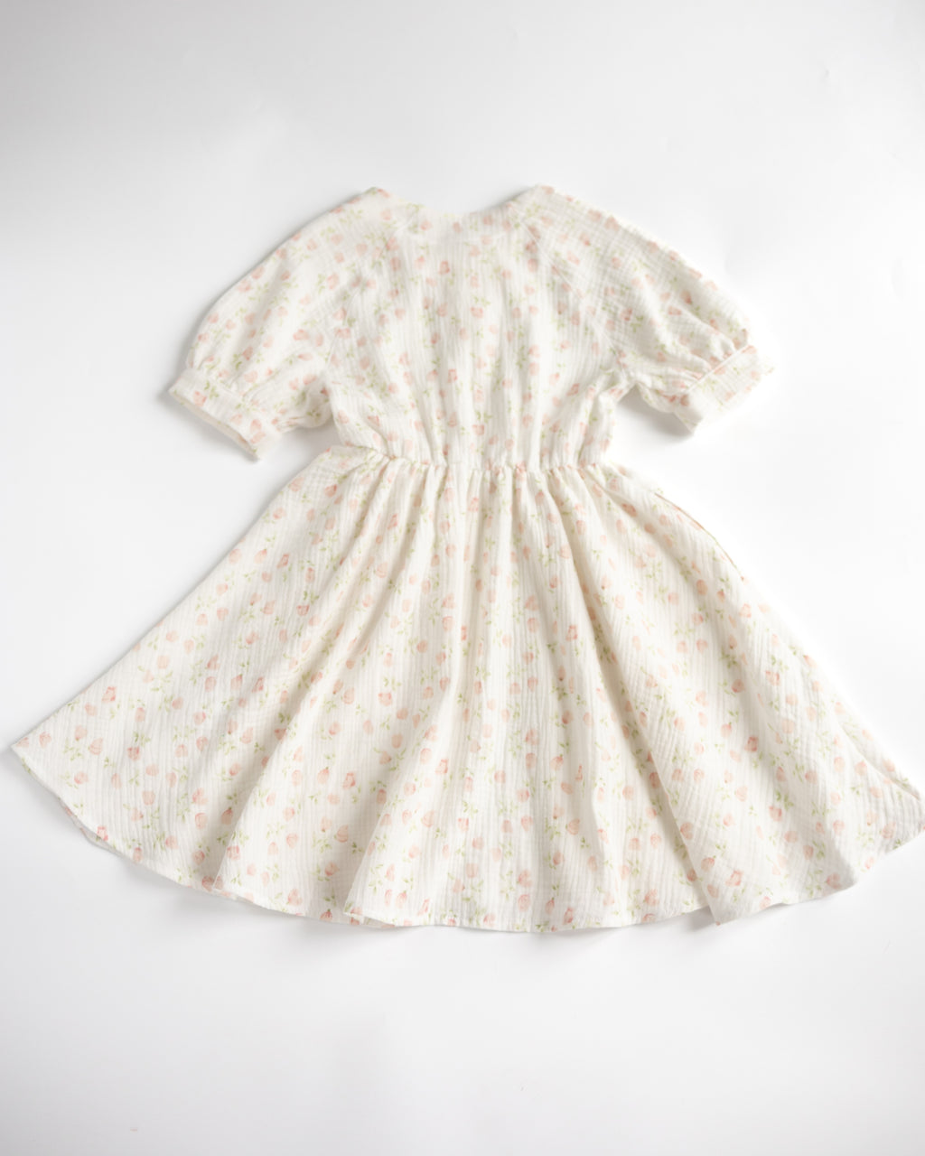 Back view of white floral muslin dress by Alwair Kids