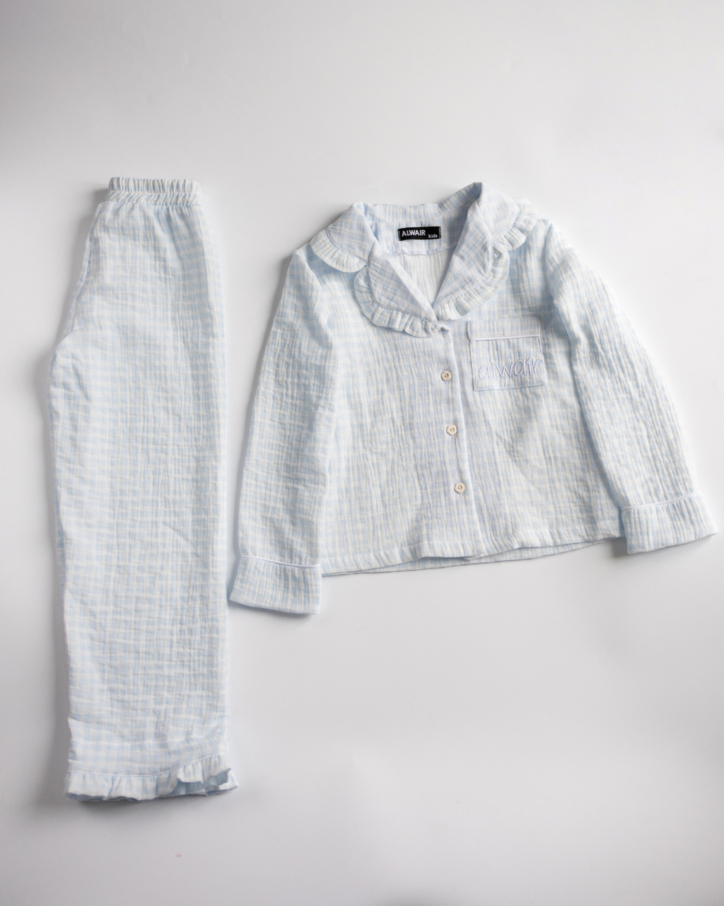 Blue checkered girls’ muslin pajama set – full view of top and pants


