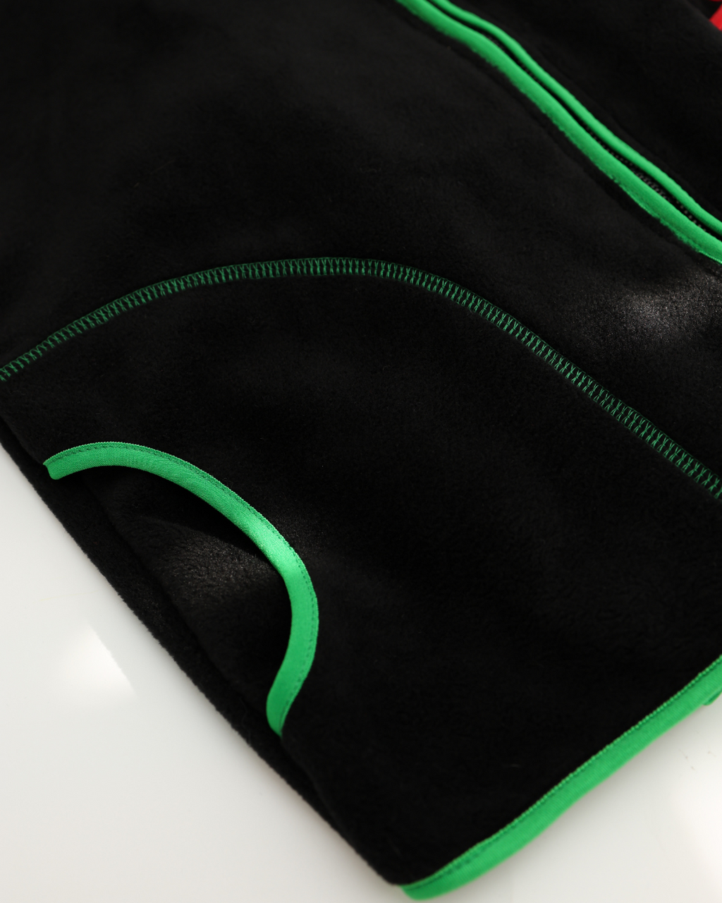 Extreme close-up of fleece fabric and pocket binding in green by Alwair Kids
