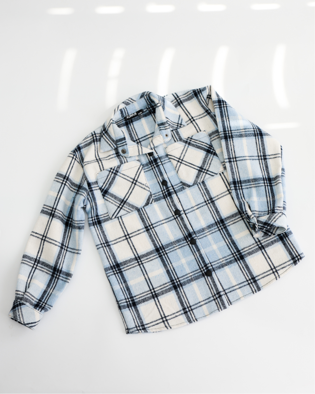 Warm blue plaid shirt for boys on white background full view