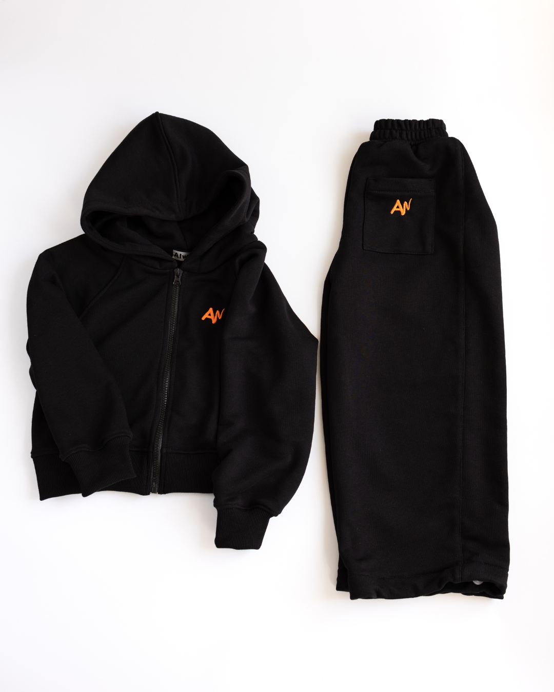 Black kids tracksuit set with zip hoodie and drawstring pants by Alwair Kids