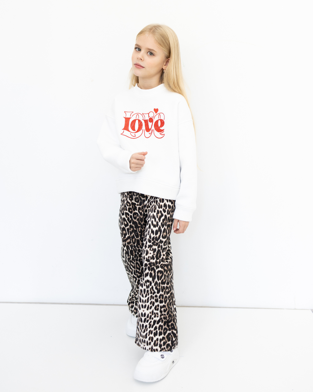 Calm pose in kids' Love sweatshirt by Alwair Kids