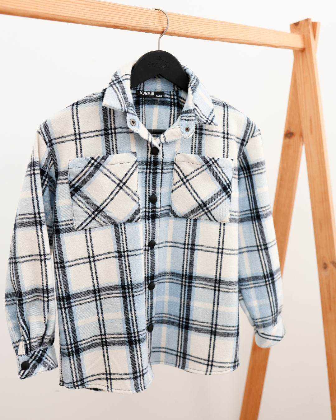 Blue plaid cotton shirt for boys hanging on wooden hanger Alwair Kids