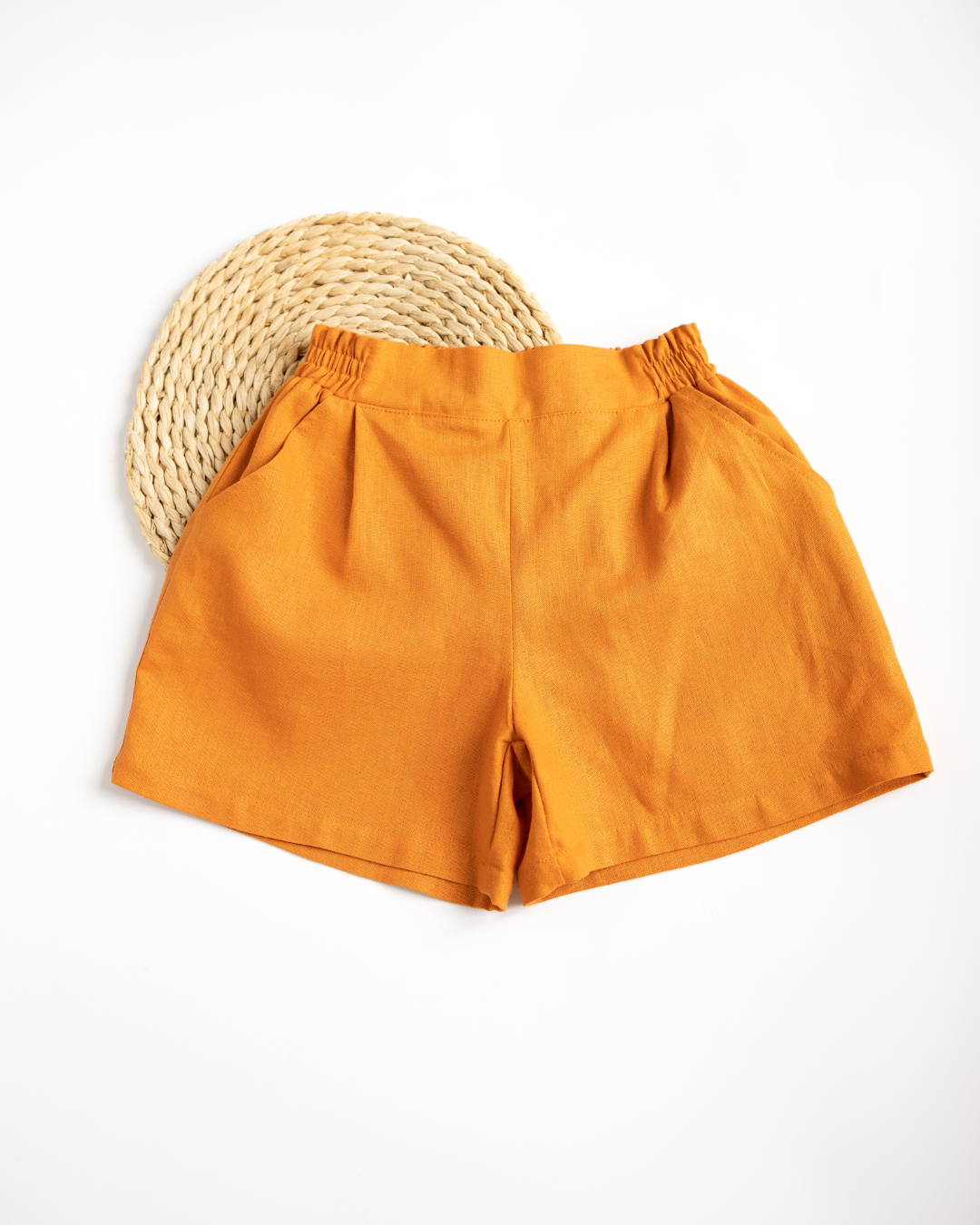 Linen shorts for kids with elastic waistband in carrot color by Alwair Kids