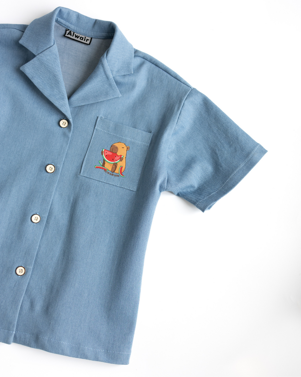 Close-up of chest pocket capybara print on girls denim shirt – Alwair Kids