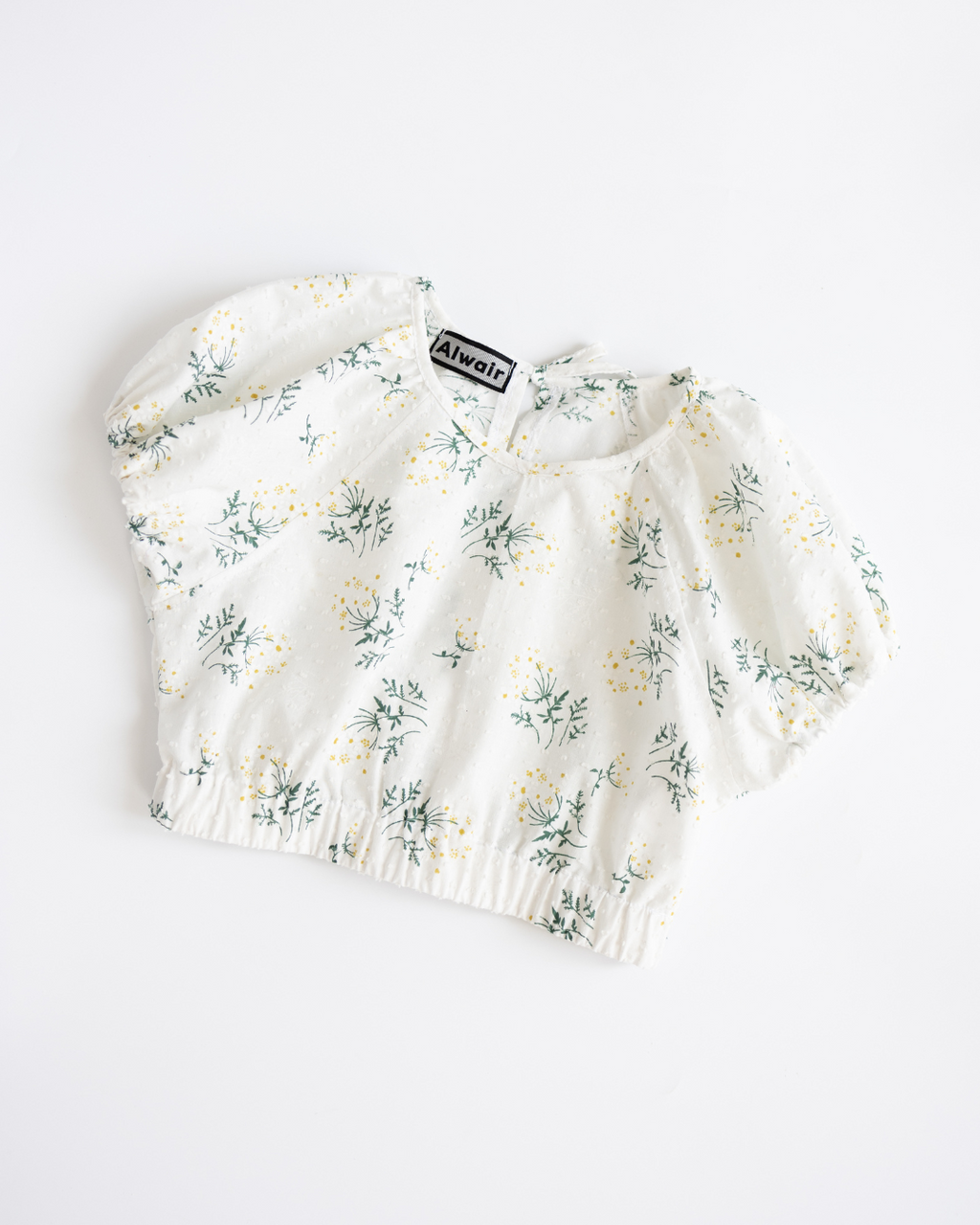 White floral girls’ top with elastic hem and puff sleeves by Alwair Kids