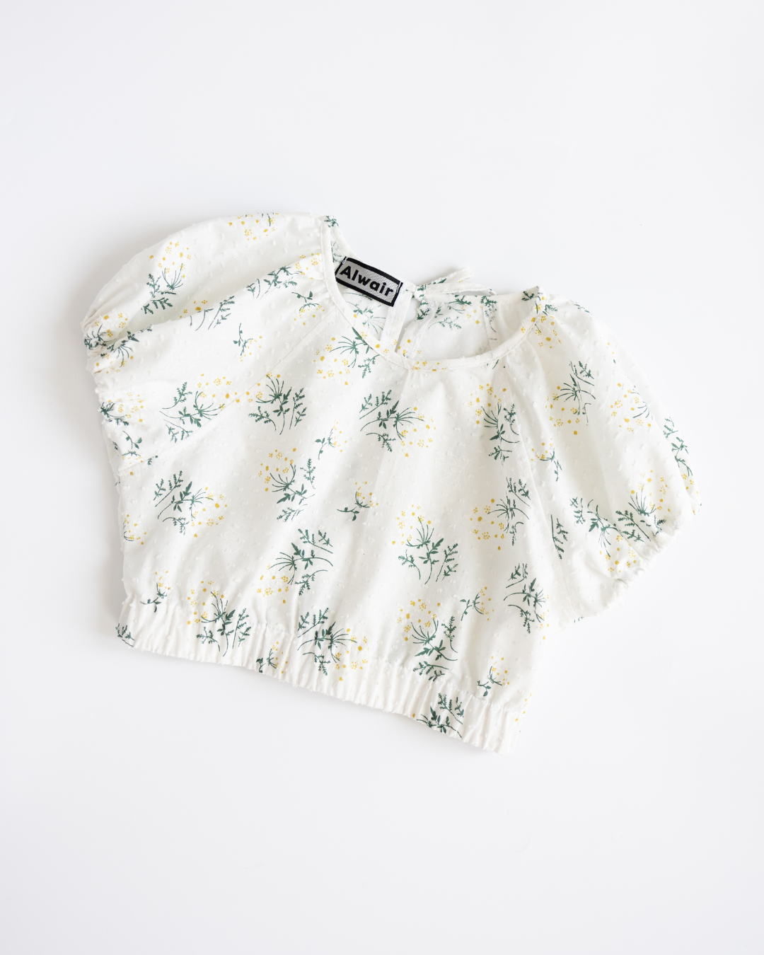 White floral girls’ top with elastic hem and puff sleeves by Alwair Kids