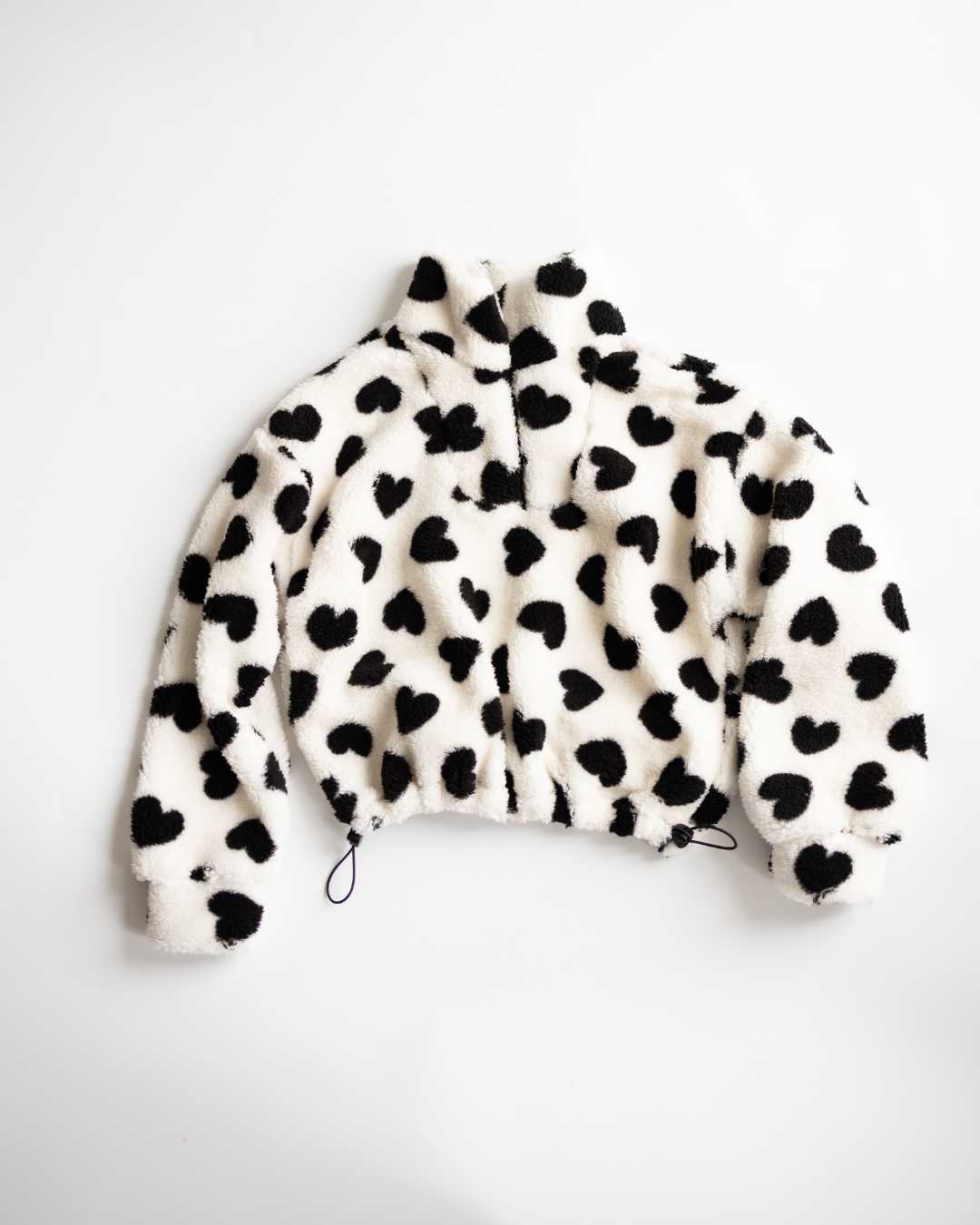 Black heart print fleece pullover for girls by Alwair Kids – front view
