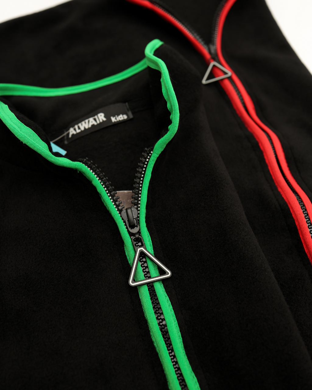 Close-up of zipper and collar details on Alwair Kids fleece jacket