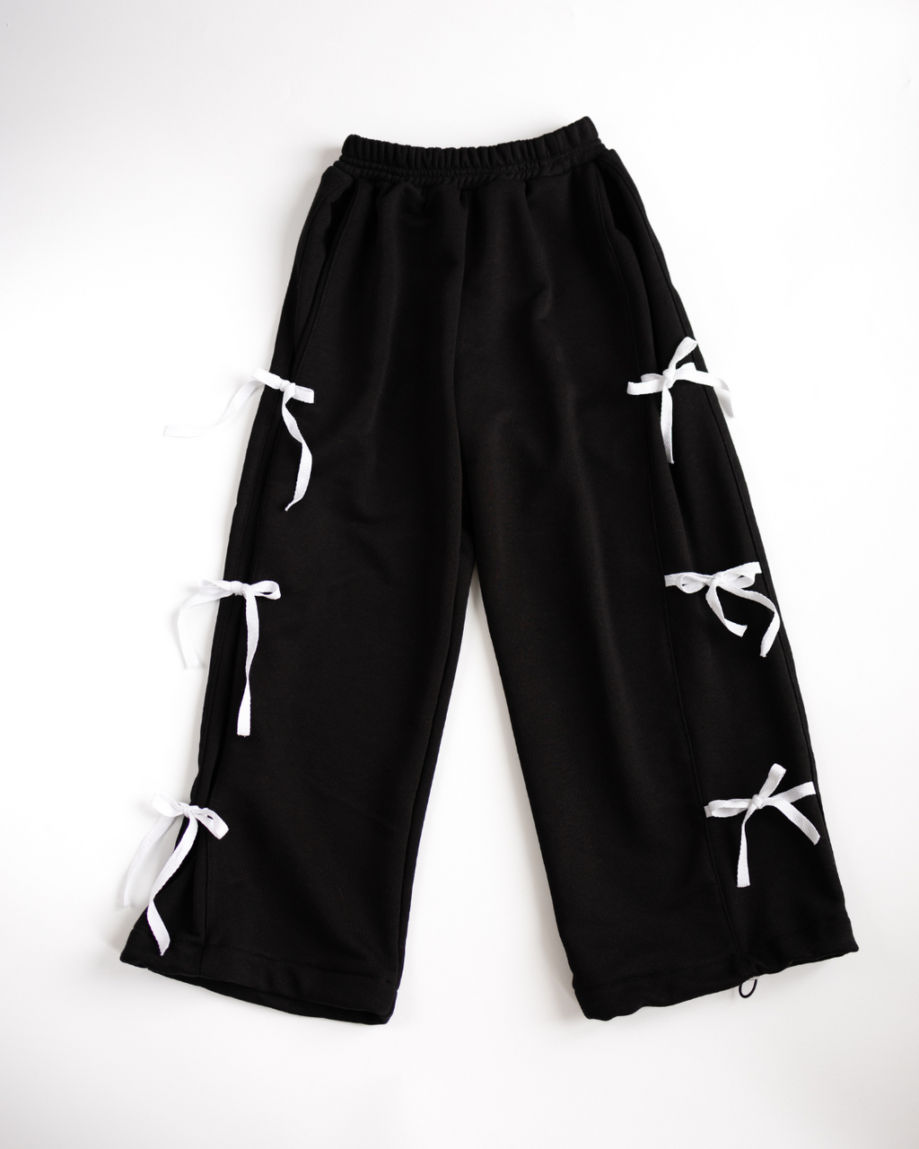 Black girls palazzo pants with bright white ribbons by Alwair Kids