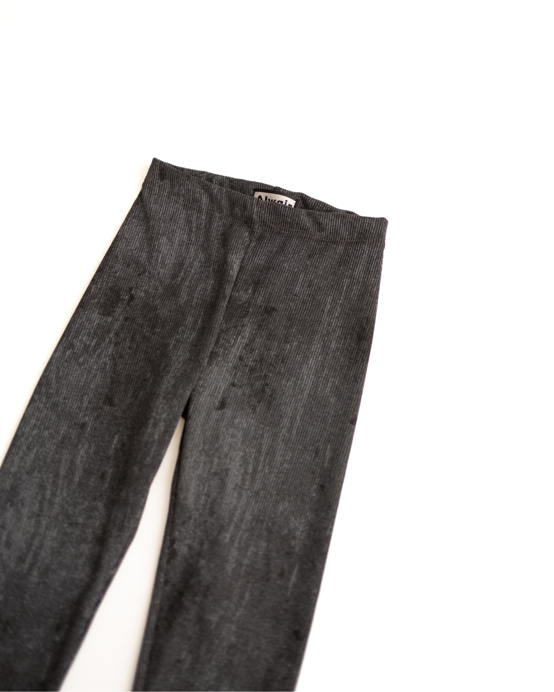 Close-up of black ribbed cotton leggings texture – Alwair Kids

