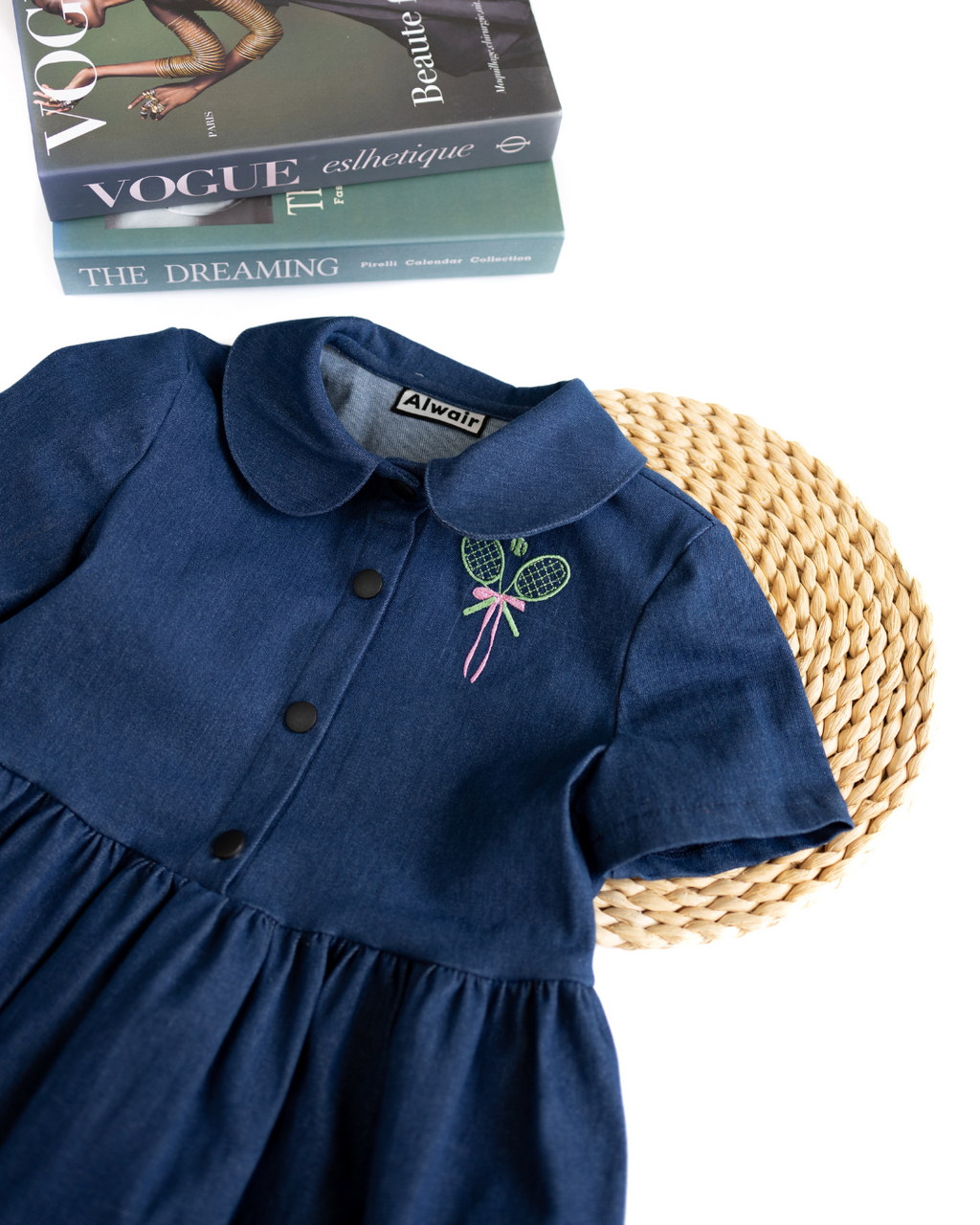 Close-up of collar and embroidered tennis rackets on Alwair Kids denim dress