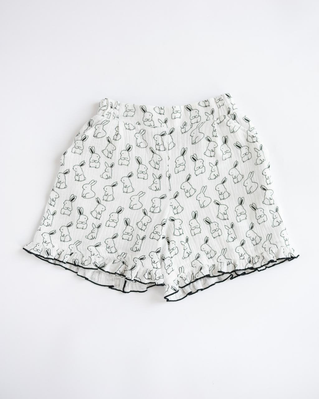 Girls pajama shorts made from soft muslin with bunny pattern and ruffle trim
