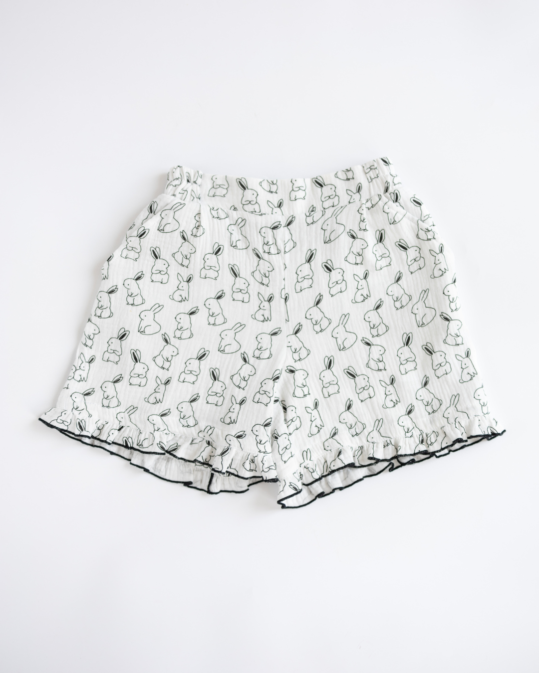 Girls pajama shorts made from soft muslin with bunny pattern and ruffle trim
