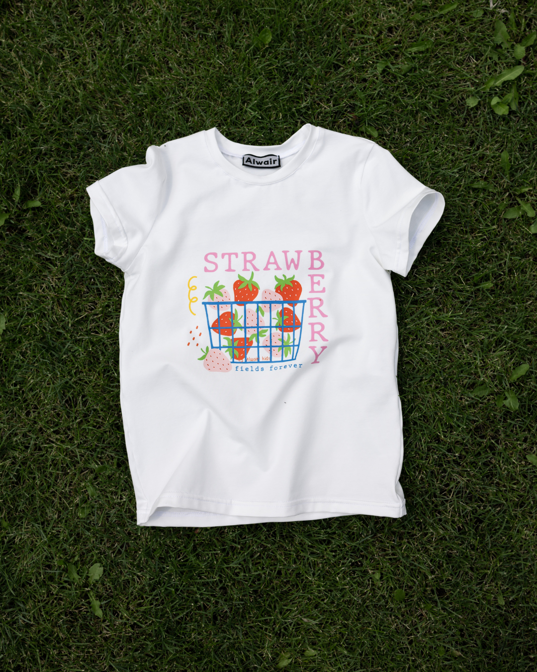 cute strawberry print t-shirt for kids on green grass bright and colorful Alwair Kids