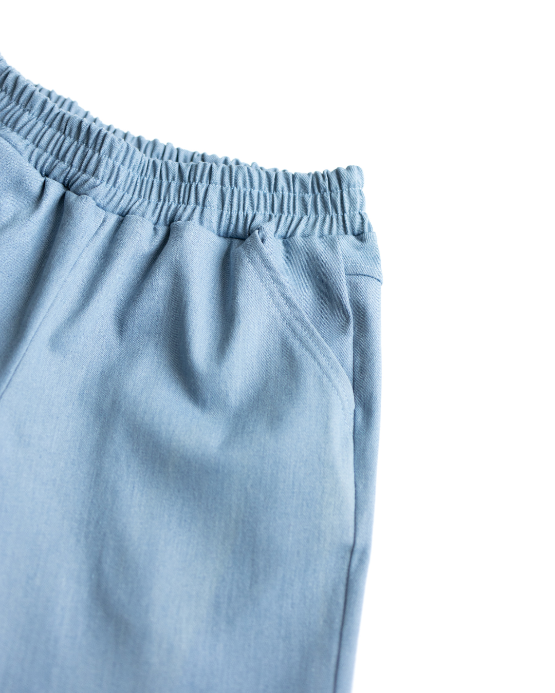 Macro view of elastic waistband and fabric detail on boys denim shorts