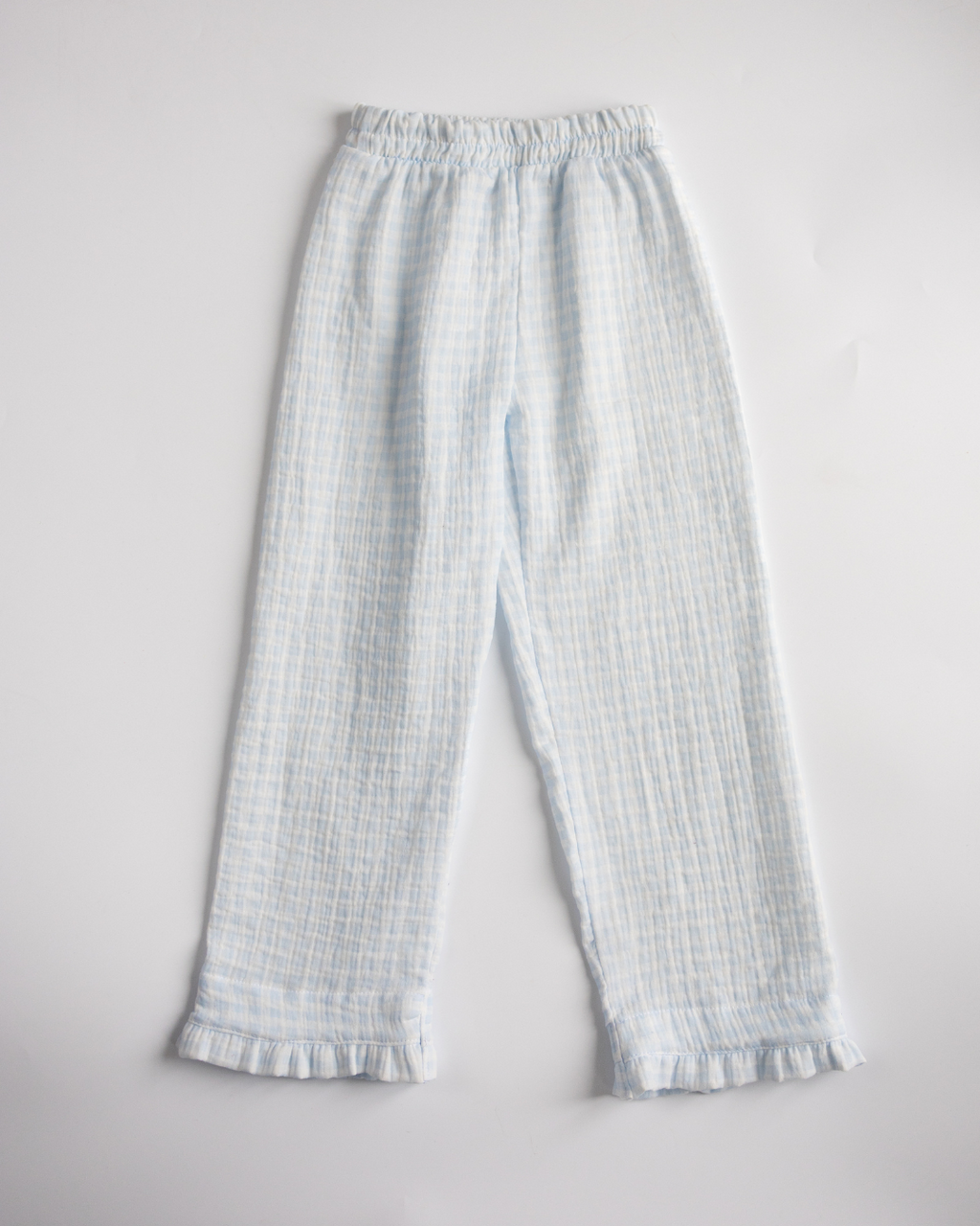 Full-length view of blue muslin pajama pants with elastic waistband