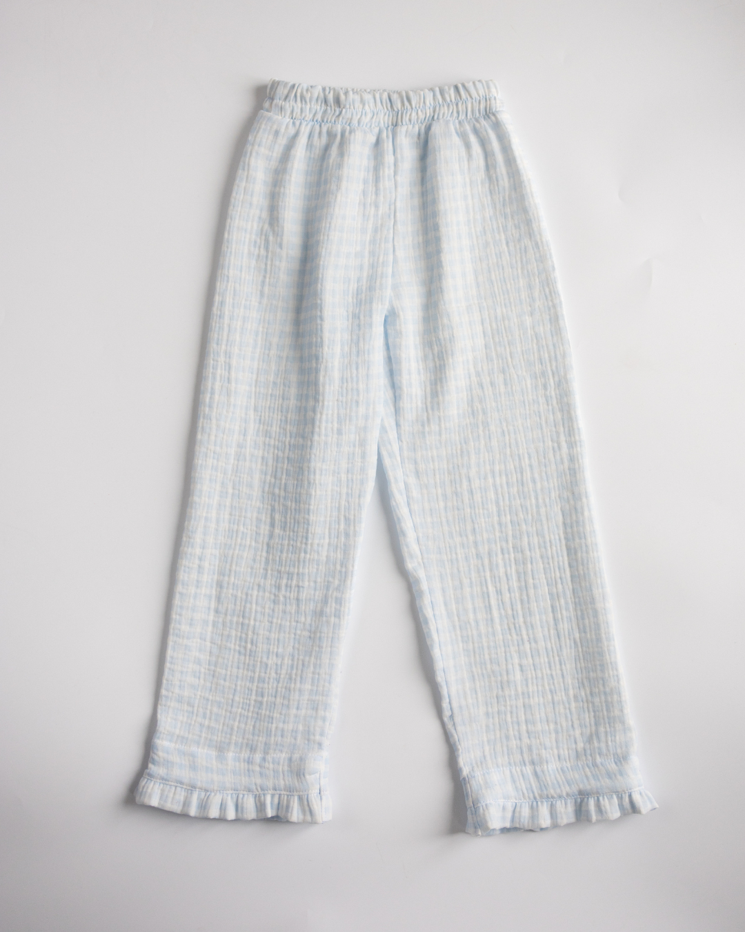Full-length view of blue muslin pajama pants with elastic waistband