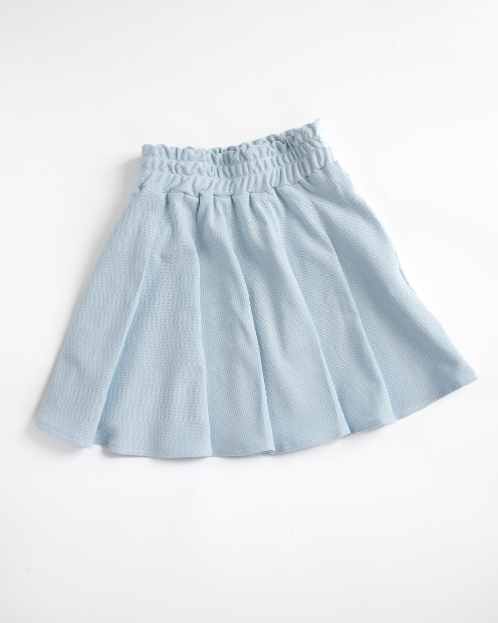 Blue pleated lacoste skirt for girls flat lay Alwair Kids