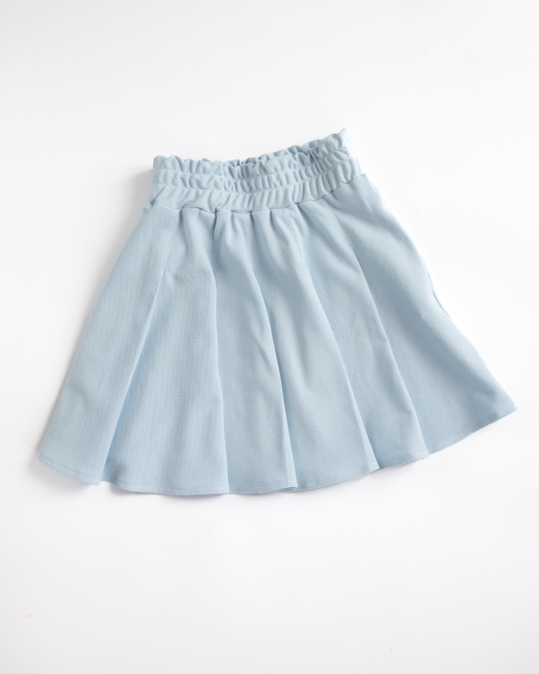 Blue pleated lacoste skirt for girls flat lay Alwair Kids