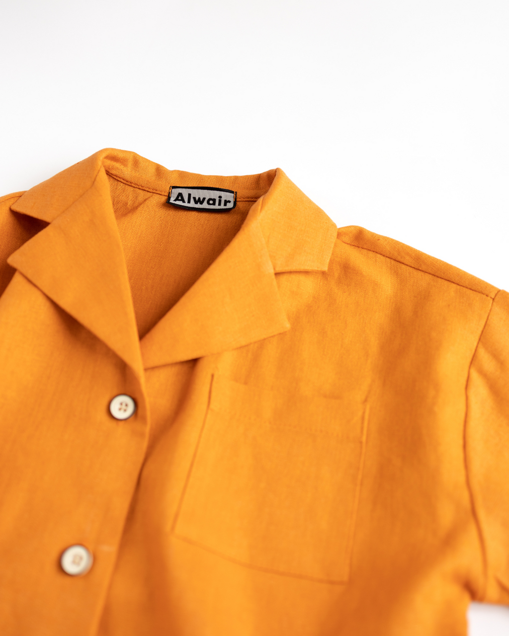 Close-up of collar and buttons on linen shirt for kids by Alwair Kids