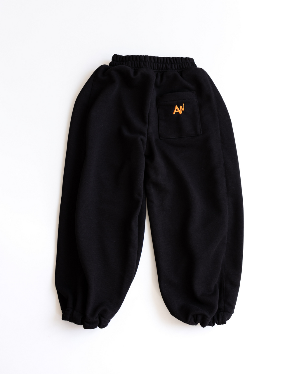 Black oversize drawstring pants for girls by Alwair Kids flat product shot