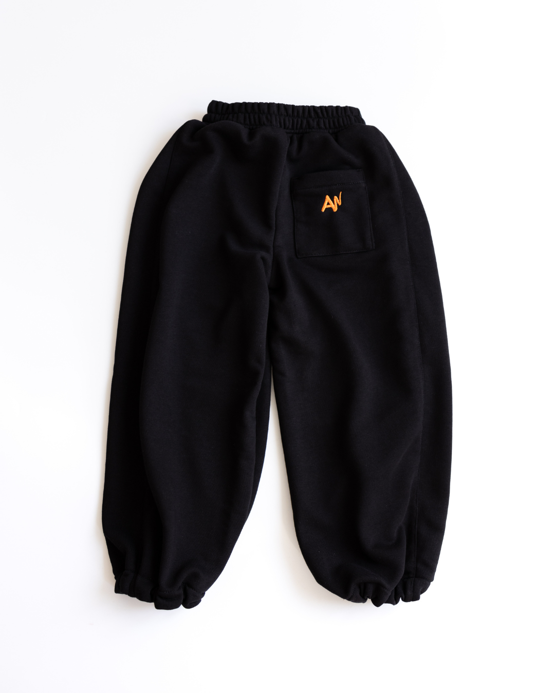 Black oversize drawstring pants for girls by Alwair Kids flat product shot