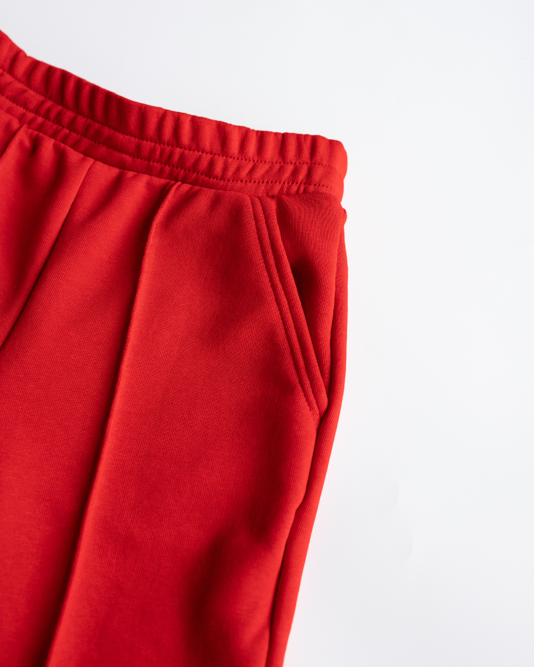 Close-up of waistband and pockets - red DIANA pants
