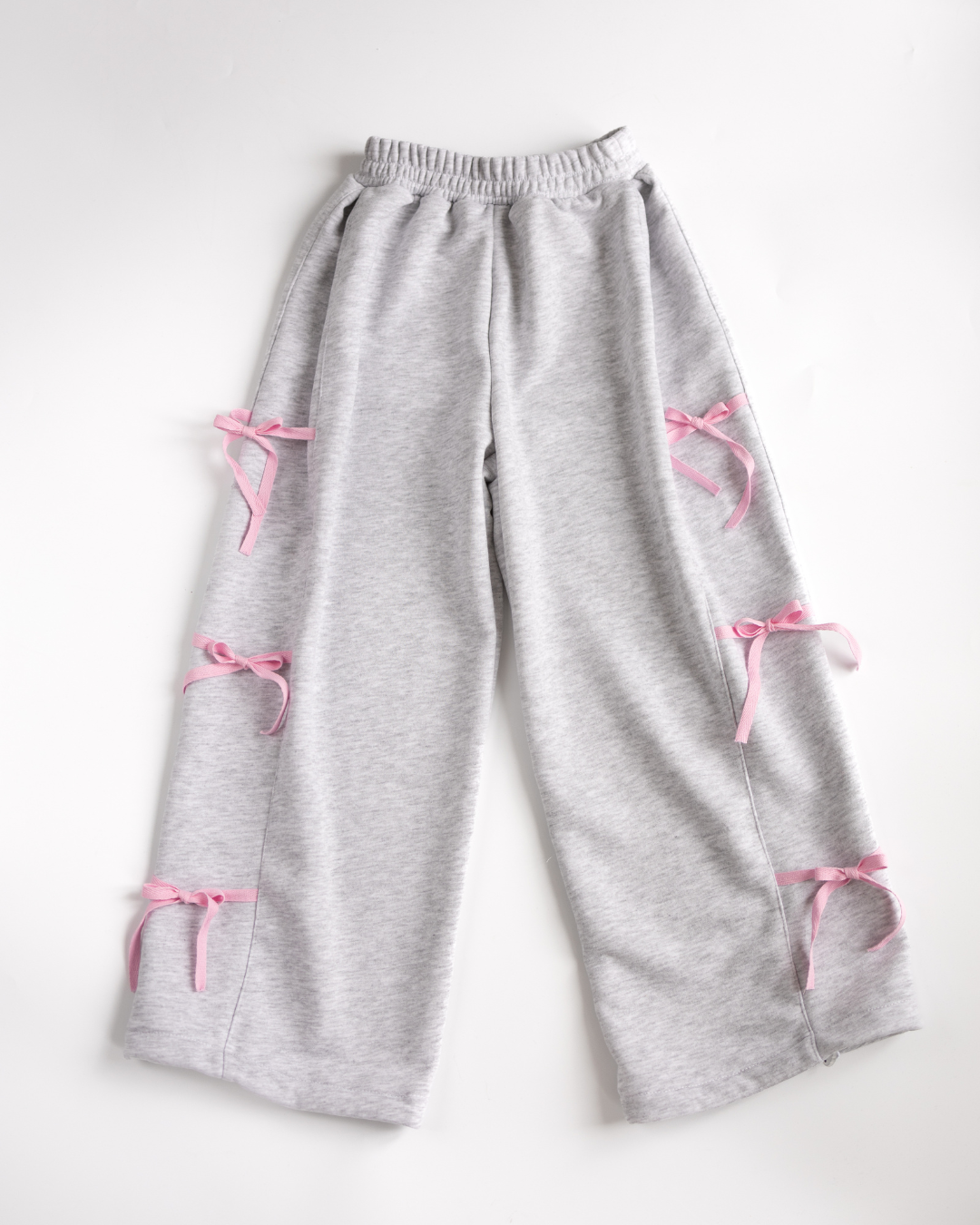 Gray palazzo pants for girls with soft pink ribbon bows by Alwair Kids