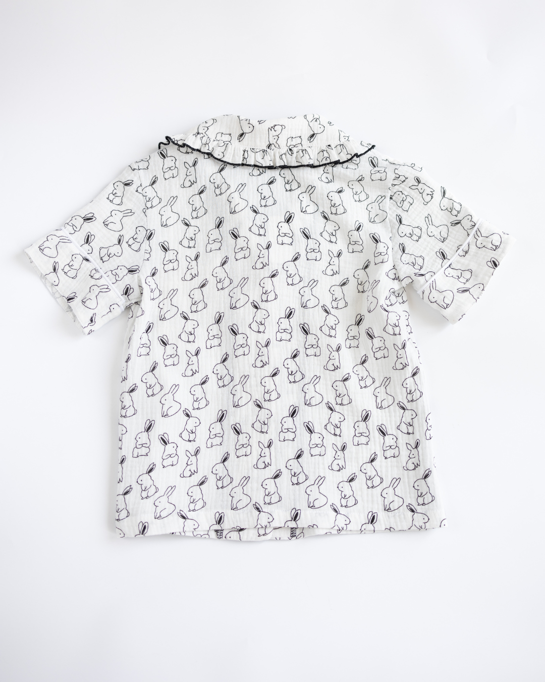 Back view of girls bunny print pajama top with frill collar
