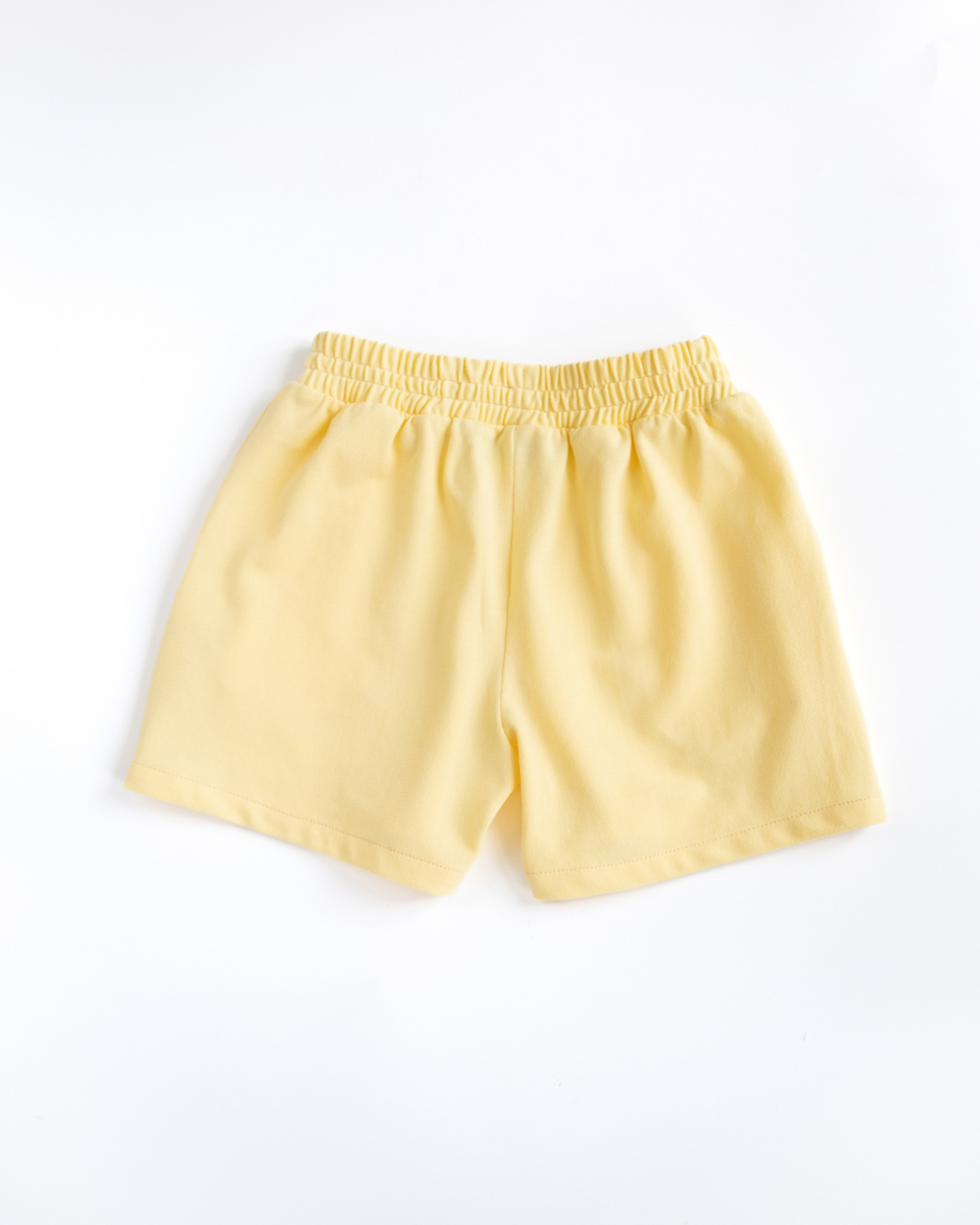 Back view of yellow cotton lacoste shorts for girls