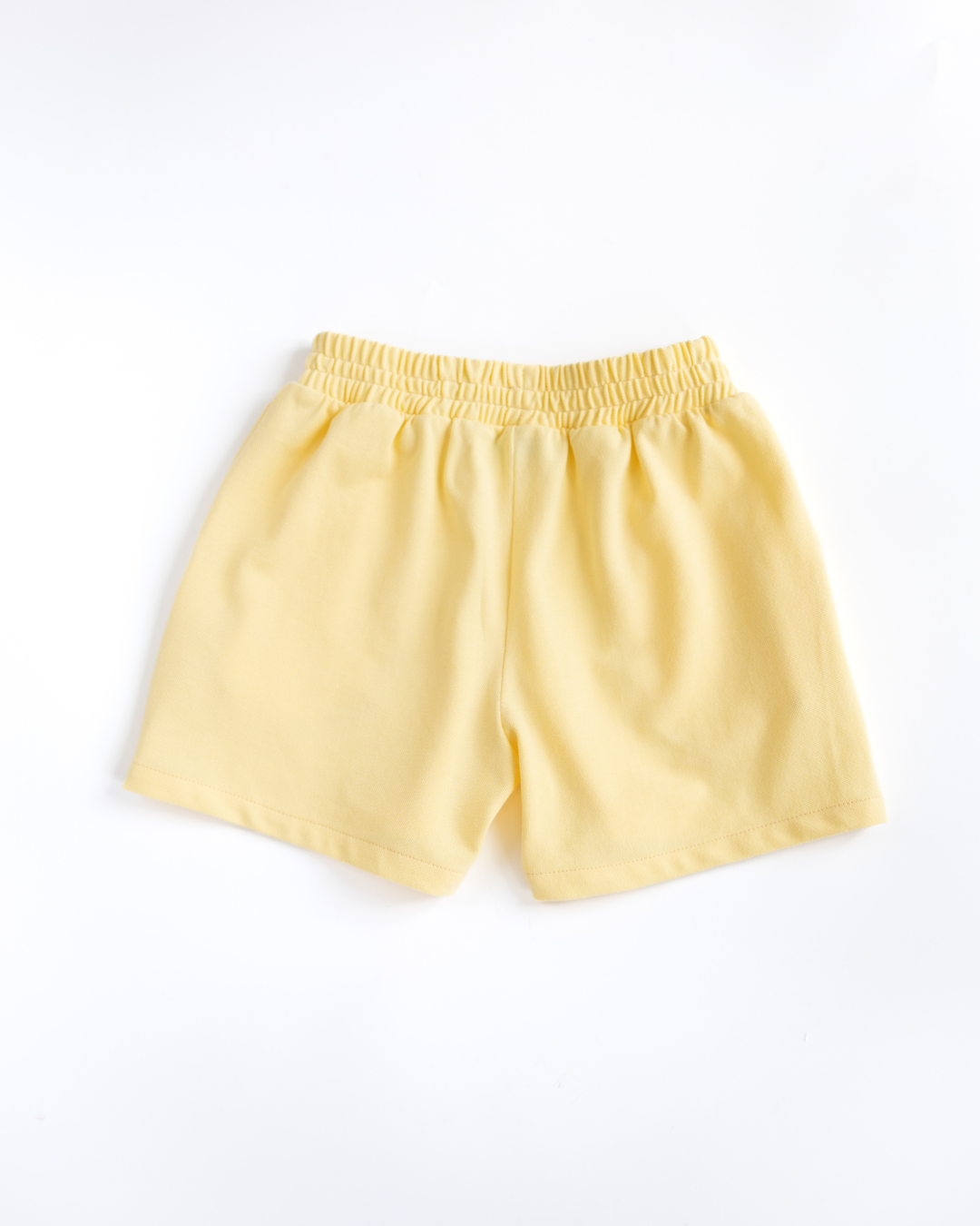 Back view of yellow cotton lacoste shorts for girls